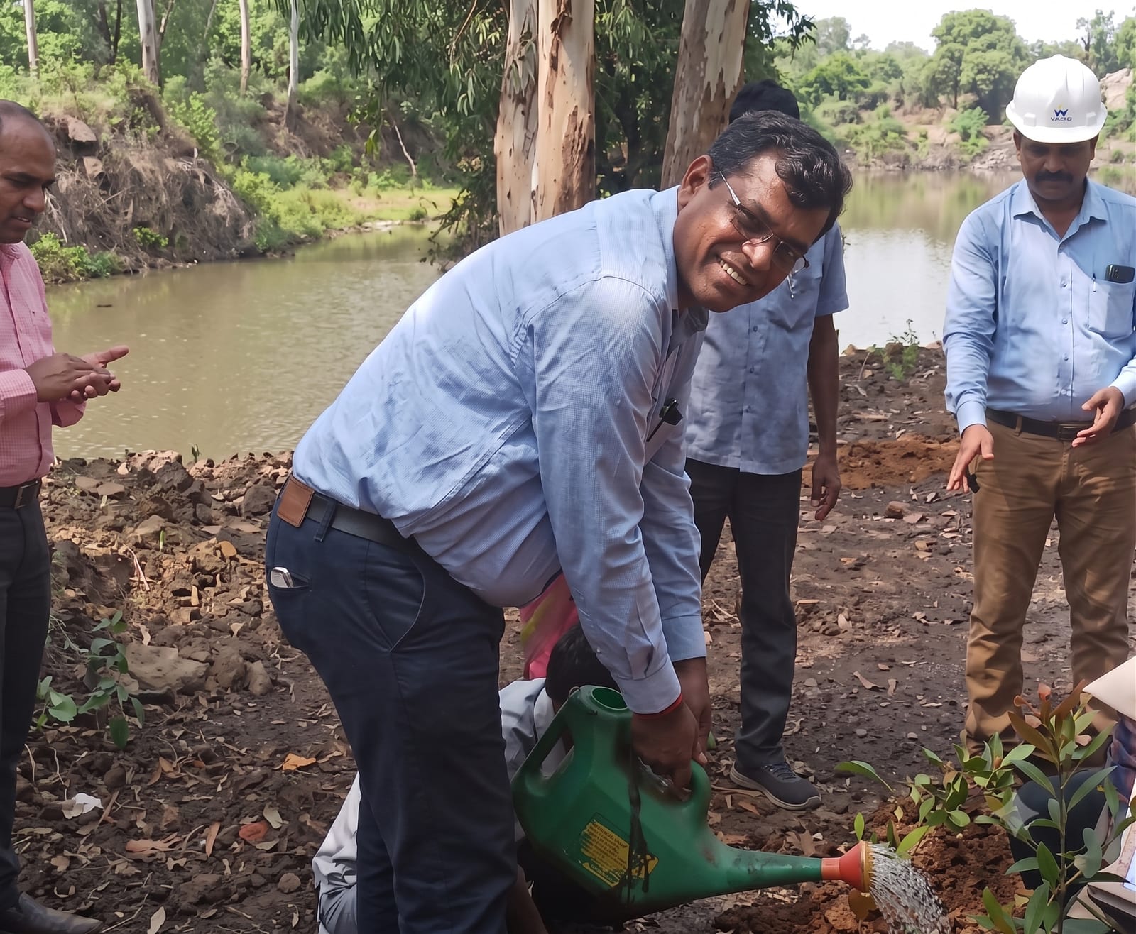 Tree-plantation drive with plant staff and village volunteers
